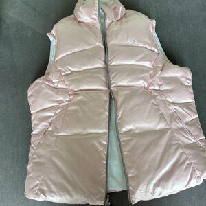 Brand New Nike Womens reversible puffer vest. 2 in 1 vest in unworn condition.